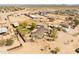 Expansive property featuring horse facilities, a well-maintained home, and desert landscaping at 28061 N Holly Rd, San Tan Valley, AZ 85143