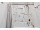 Beautiful bathroom with marble tile, bronze fixtures, and a built-in shower niche at 28061 N Holly Rd, San Tan Valley, AZ 85143