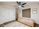 bedroom features closet, ceiling fan, light-colored wood floors and a window at 28061 N Holly Rd, San Tan Valley, AZ 85143