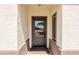 Inviting entryway with a glass-paneled front door and neutral decor, leading to a bright and welcoming interior at 28061 N Holly Rd, San Tan Valley, AZ 85143