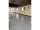 Spacious garage with sealed floors, lighting, and ample room for vehicles and projects at 28061 N Holly Rd, San Tan Valley, AZ 85143