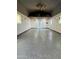 Bright and expansive garage features sealed floors, natural light, and plenty of workspace at 28061 N Holly Rd, San Tan Valley, AZ 85143