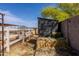 Exterior shot of a gray shed and the horse pen and area at 28061 N Holly Rd, San Tan Valley, AZ 85143