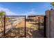 Exterior shot of fenced horse area with white fencing and an open gate at 28061 N Holly Rd, San Tan Valley, AZ 85143