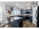 Kitchen showcasing peninsula countertop and stainless steel appliances at 28061 N Holly Rd, San Tan Valley, AZ 85143