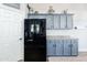 Spacious kitchen with stainless steel refrigerator and plenty of cabinet space at 28061 N Holly Rd, San Tan Valley, AZ 85143