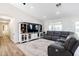 Spacious living room with stylish console and comfortable sectional seating at 28061 N Holly Rd, San Tan Valley, AZ 85143