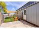 Exterior showcasing an outbuilding with a fenced-in play area, perfect for recreation, activities, and enjoying the outdoors at 28061 N Holly Rd, San Tan Valley, AZ 85143
