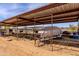 Metal paddock sheltering a covered boat in this versatile space at 28061 N Holly Rd, San Tan Valley, AZ 85143