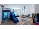 Fun playroom featuring a slide, swing, and lounging area at 28061 N Holly Rd, San Tan Valley, AZ 85143