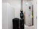 This utility room features a water heater, water softener, and additional water filtration equipment at 28061 N Holly Rd, San Tan Valley, AZ 85143