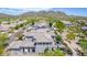 Aerial view of the neighborhood, featuring mountain views and desert landscaping at 3025 W Sentinel Rock Rd, Phoenix, AZ 85086