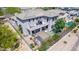 Aerial view of the backyard featuring a covered patio, lush landscaping, and beautiful mountain community views at 3025 W Sentinel Rock Rd, Phoenix, AZ 85086