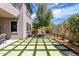 Beautiful backyard featuring a modern grid-patterned lawn and desert landscaping at 3025 W Sentinel Rock Rd, Phoenix, AZ 85086