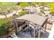 Shaded backyard patio featuring comfortable seating and lush floral landscaping, perfect for outdoor relaxation at 3025 W Sentinel Rock Rd, Phoenix, AZ 85086