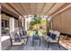 Inviting backyard patio with comfortable seating, pergola, and unique grid-patterned lawn at 3025 W Sentinel Rock Rd, Phoenix, AZ 85086
