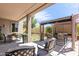 Spacious covered patio with stylish seating, pergola, and a unique grid-patterned lawn at 3025 W Sentinel Rock Rd, Phoenix, AZ 85086