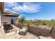 Spacious balcony with outdoor seating, umbrella, and picturesque neighborhood views under a sunny sky at 3025 W Sentinel Rock Rd, Phoenix, AZ 85086