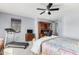 Bedroom includes a ceiling fan, desk, dresser, and treadmill by window, showing space and function at 3025 W Sentinel Rock Rd, Phoenix, AZ 85086