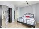 Modern bedroom with an iron frame bed, stylish shelving, and clear decor for a serene living space at 3025 W Sentinel Rock Rd, Phoenix, AZ 85086