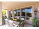 Comfortable covered patio with outdoor dining set and views of the landscaped backyard at 3025 W Sentinel Rock Rd, Phoenix, AZ 85086