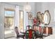 Dining area with a round table, chandelier, and sliding glass doors for outdoor access at 3025 W Sentinel Rock Rd, Phoenix, AZ 85086