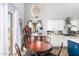 Charming dining area features a chandelier, wood table, and adjacent kitchen space at 3025 W Sentinel Rock Rd, Phoenix, AZ 85086