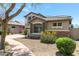 Home with a well-maintained lawn and desert landscaping at 3025 W Sentinel Rock Rd, Phoenix, AZ 85086
