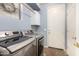 Efficient laundry room with modern washer and dryer units, bright lighting, and storage solutions at 3025 W Sentinel Rock Rd, Phoenix, AZ 85086
