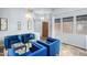 Living room with blue couches, accent lighting, and neutral walls at 3025 W Sentinel Rock Rd, Phoenix, AZ 85086
