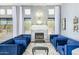 Living room with blue couches, fireplace, and natural light at 3025 W Sentinel Rock Rd, Phoenix, AZ 85086