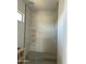 Modern bathroom featuring a stylish tiled shower with built-in shelving and sleek fixtures at 3374 E Aquarius Ct, Chandler, AZ 85249