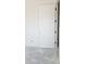 Unfinished bedroom with a door with modern hardware at 3374 E Aquarius Ct, Chandler, AZ 85249