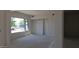 An unfinished bedroom with a window and sliding door at 3374 E Aquarius Ct, Chandler, AZ 85249