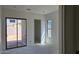 Unfinished bedroom with a window and sliding door at 3374 E Aquarius Ct, Chandler, AZ 85249