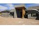 Exterior view of home under construction, featuring a modern design and natural wood accents at 3374 E Aquarius Ct, Chandler, AZ 85249