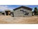 Exterior view of a home under construction, featuring a modern facade with unique window design at 3374 E Aquarius Ct, Chandler, AZ 85249