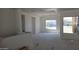 Bright living room with tray ceilings and large windows showcasing the home under construction at 3374 E Aquarius Ct, Chandler, AZ 85249
