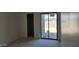 Living room with sliding glass door access to backyard provides ample natural light to the home at 3374 E Aquarius Ct, Chandler, AZ 85249