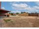 Large, private backyard featuring a covered patio and secure fencing at 3916 W Northview Ave, Phoenix, AZ 85051