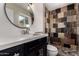 Modern bathroom features a sleek shower, stylish vanity, and contemporary fixtures at 3916 W Northview Ave, Phoenix, AZ 85051
