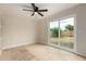 Bright bedroom with neutral walls, tile floors, fan and large sliding glass door to backyard at 3916 W Northview Ave, Phoenix, AZ 85051