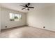 Bright bedroom with neutral walls, tile flooring, and a large window providing natural light at 3916 W Northview Ave, Phoenix, AZ 85051
