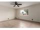 Inviting bedroom with neutral walls, tile flooring, and a large window providing natural light at 3916 W Northview Ave, Phoenix, AZ 85051