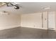 Spacious garage with a mini-split air conditioning unit and an automatic garage door at 3916 W Northview Ave, Phoenix, AZ 85051