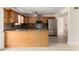 Spacious kitchen featuring granite countertops, stainless steel appliances, and custom wood cabinetry at 3916 W Northview Ave, Phoenix, AZ 85051