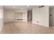 Open-concept living room boasts neutral colors, tile floors, and a charming decorative alcove at 3916 W Northview Ave, Phoenix, AZ 85051