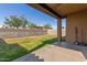 View of the backyard featuring block wall fence and covered patio at 4050 W Coles Rd, Laveen, AZ 85339