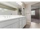Bathroom featuring double vanity, a large mirror, and modern fixtures at 4050 W Coles Rd, Laveen, AZ 85339