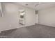 Bedroom view to bathroom featuring neutral paint, carpet, and ample natural light at 4050 W Coles Rd, Laveen, AZ 85339